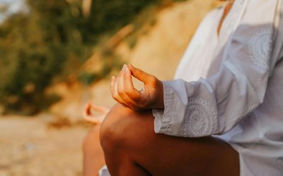 Close-up of hands in a specific yoga mudra.