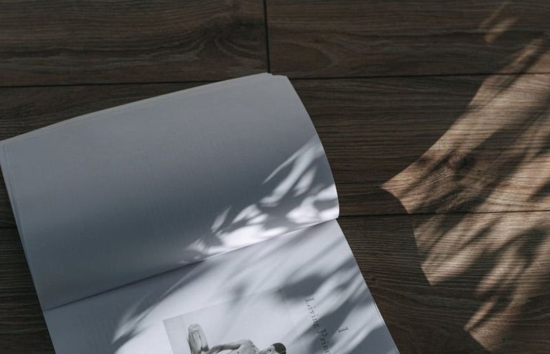 Wide shot of an empty, peaceful yoga studio with morning light.